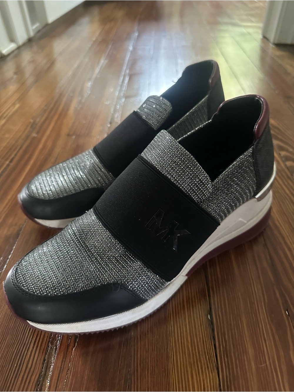 Michael Kors Black and Silver Slip-On MK Logo Knit Sneakers with Burgundy Accent